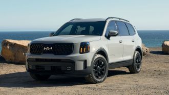2024 Kia Telluride XPro in wolf gray with ocean in the background.