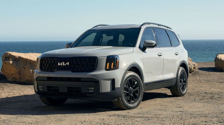 2024 Kia Telluride XPro in wolf gray with ocean in the background.