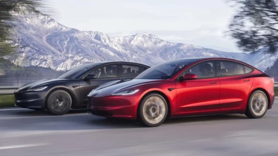 A pair of restyled 2024 Tesla Model 3 sedans seen from a front quarter angle 