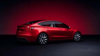The 2024 Tesla Model 3 seen from a rear quarter angle