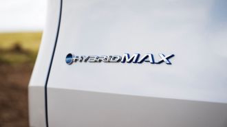 2024 Toyota Grand Highlander Hybrid badge.