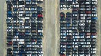 a parking lot full of cars awaiting auction
