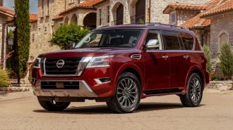 2023 Nissan Armada Platinum in red.