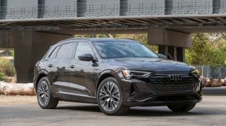 2024 Audi Q8 e-tron near a bridge.