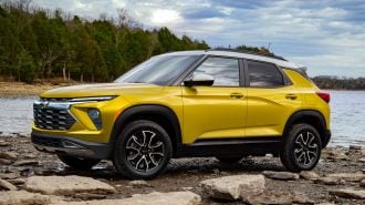 2024 Chevrolet Trailblazer ACTIV in yellow near a lake.