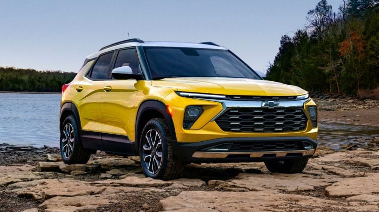 2024 Chevrolet Trailblazer ACTIV in yellow near a lake.
