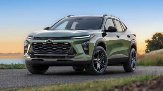 2024 Chevrolet Trax ACTIV in green near a lake.