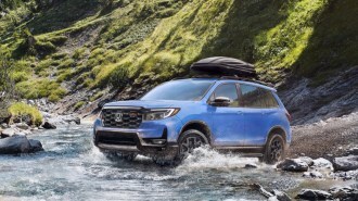 The 2024 Honda Passport TrailSport seen crossing a stream