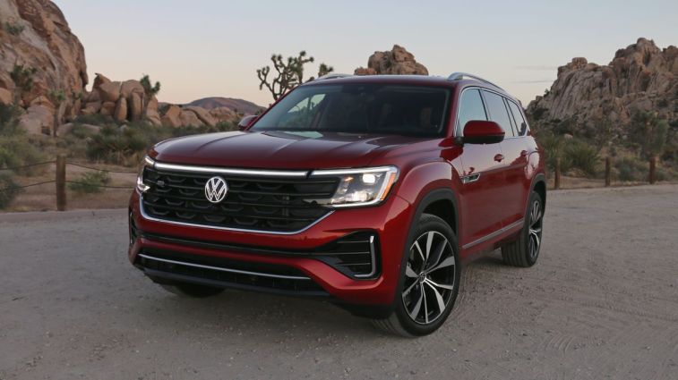 2024 Volkswagen Atlas SEL in red with rock formations in the background.