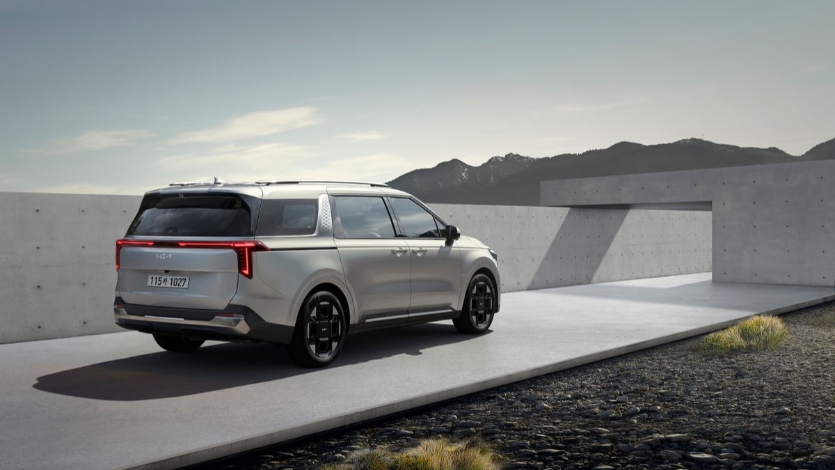 The 2025 Kia Carnival seen from a rear quarter angle