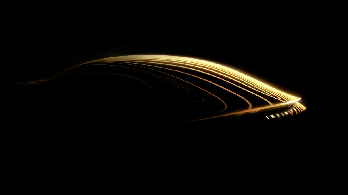 A teaser image showing the Infiniti Vision Qe concept seen from a rear quarter angle
