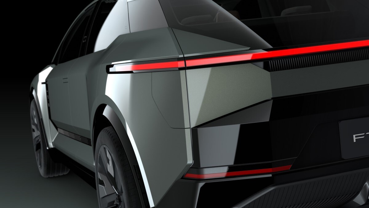 A teaser rendering of the Toyota FT-3e concept, seen from a rear quarter angle