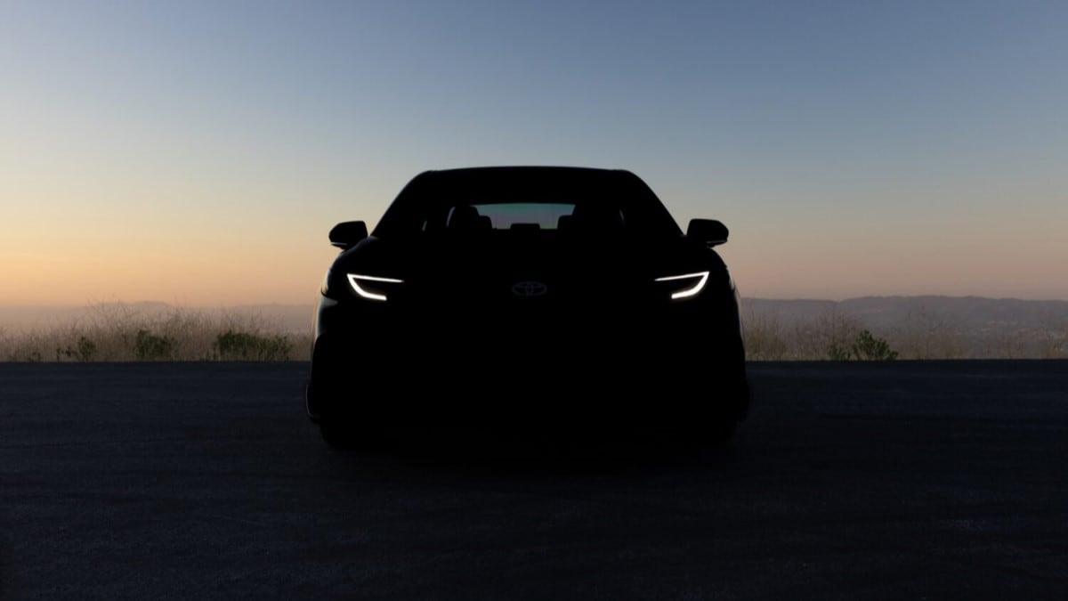 A teaser photo showing what is likely the 2025 Toyota Camry in heavy shadow