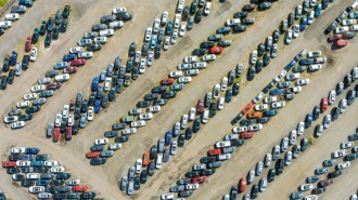 a lot filled with used cars ready for auction
