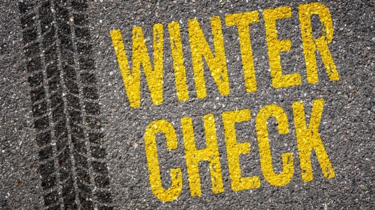 Winter check written on road lane