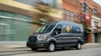 A 2023 Ford E-Transit electric van seen from a front quarter angle