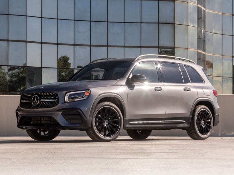2023 Mercedes-Benz GLB 250 in charcoal grey near an office building.