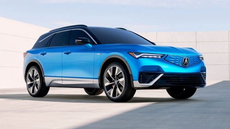 2024 Acura ZDX Type S in blue with a concrete wall in the background.