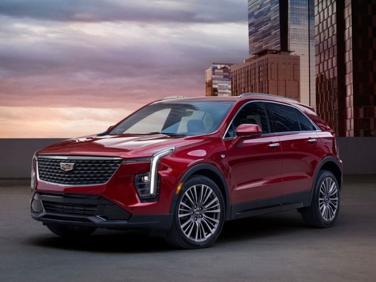 2024 Cadillac XT4 in red near tall buildings.