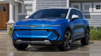 2024 Chevrolet Equinox EV 3LT in Riptide Blue parked in front of a home.