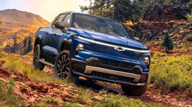 2024 Silverado EV RST in blue off roading.