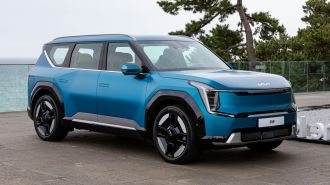 2024 Kia EV9 in blue near the ocean.