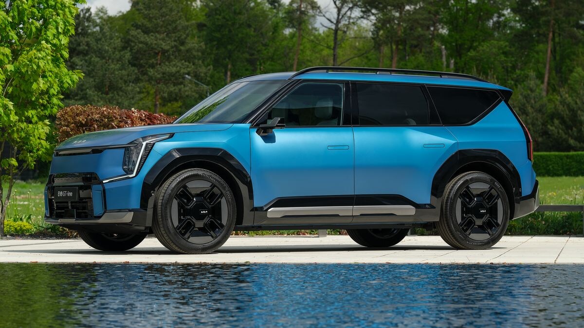 2024 Kia EV9 GT-Line in blue near a pond.