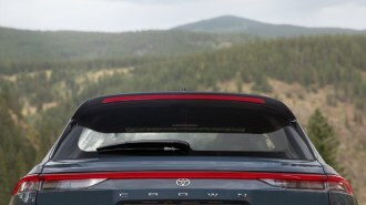 A teaser photo showing the rear of the Toyota Crown SUV from the beltline up