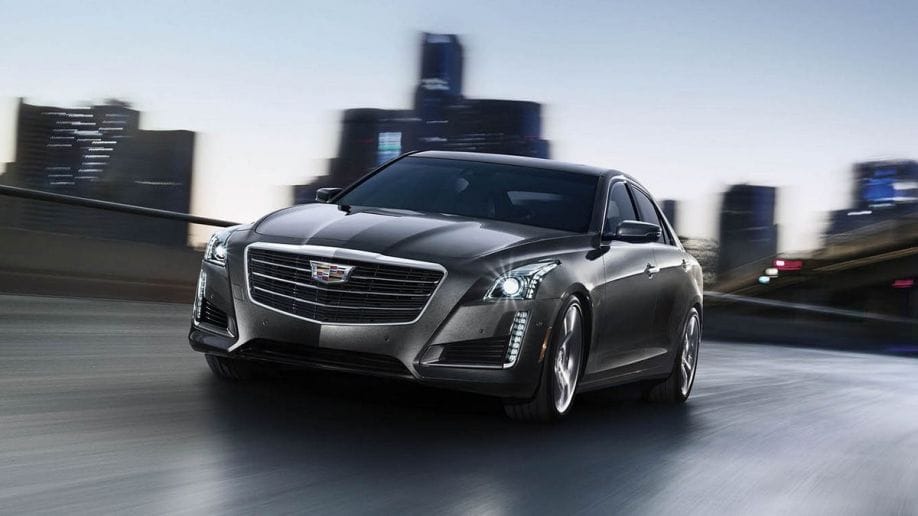 2015 Cadillac CTS sedan driving in the city.