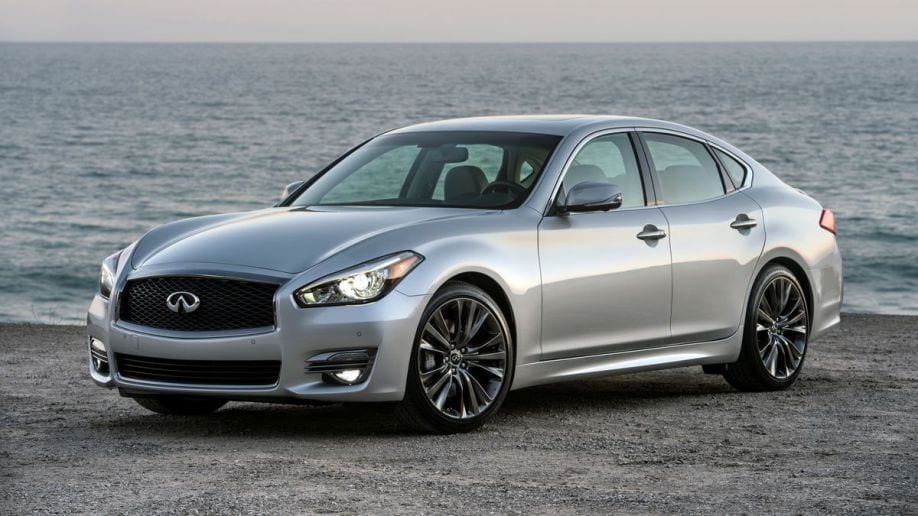2016 Infiniti Q70 in silver on the beach at sunset.