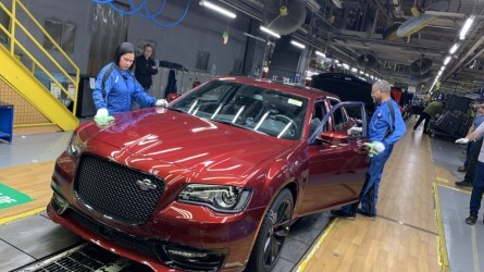 Factor workers inspect the final Chrysler 300C