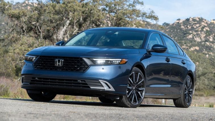 2024 Honda Accord Hybrid with a tree in the background.