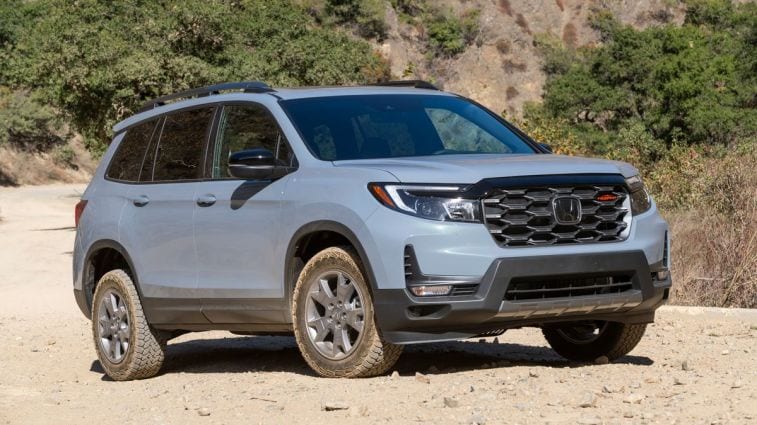 2024 Honda Passport TrailSport on a dirt road.