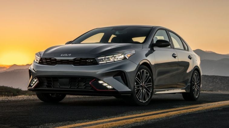 2024 Kia Forte in grey at sunset.