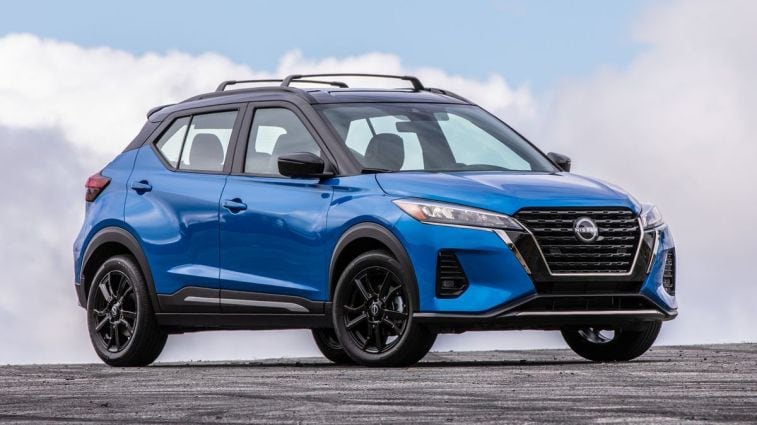 2024 Nissan Kicks in blue with clouds in the background.