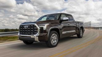 2024 Toyota Tundra 1794 Edition driving down a highway.