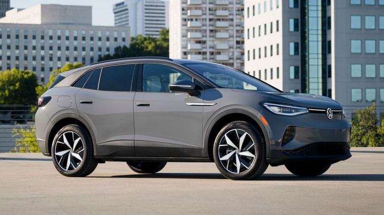 2024 Volkswagen ID.4 in grey with buildings in the background.