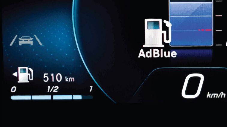 Lane keeping and fuel level icons.