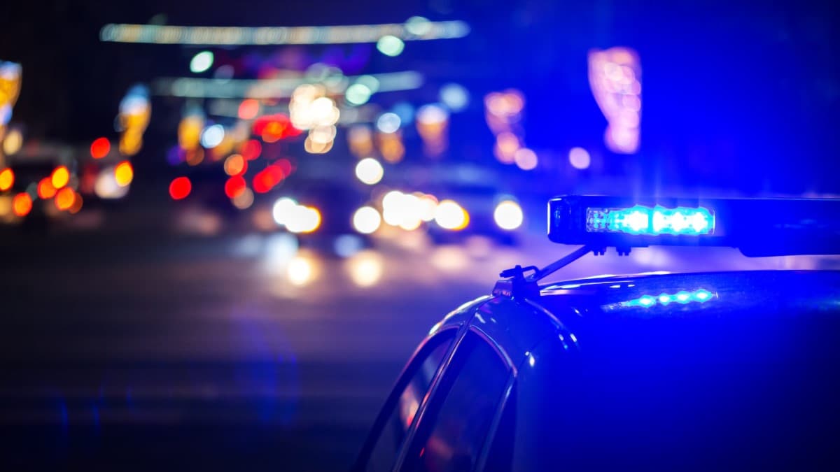 A police car seen at night