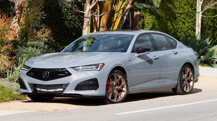 2024 Acura TLX S Type in Pearl Urban Gray near palm trees and toys.