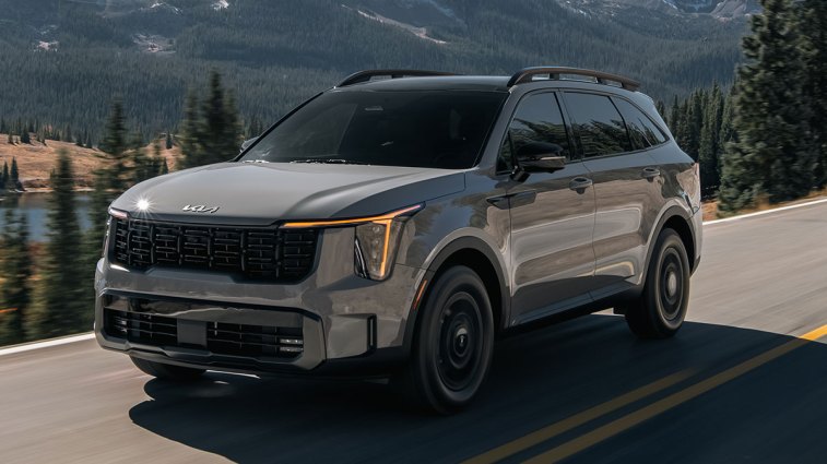 2024 Kia Sorento in grey driving down a mountain highway.