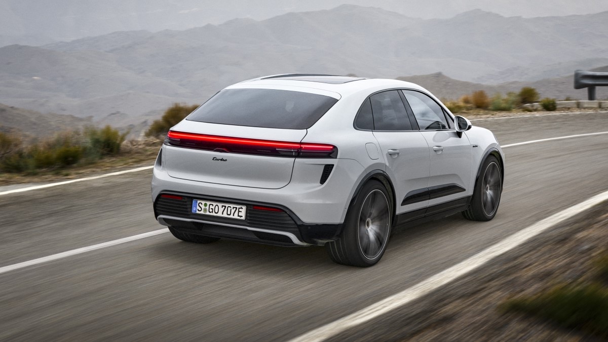 The 2024 Porsche Macan EV seen from a rear quarter angle
