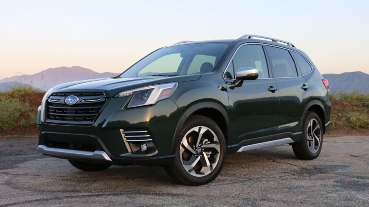 2024 Subaru Forester in green at sunrise.