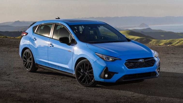 2024 Subaru Impreza RS with the ocean in the background.