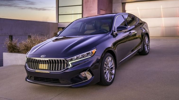 2020 Kia Cadenza in front of a residential garage.