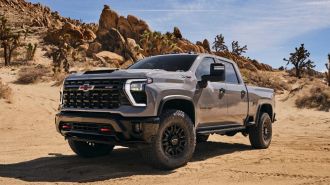 2024 Silverado HD ZR2 in grey near rocks in the desert.