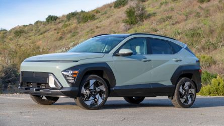2024 Hyundai Kona Limited in Mirage Green with hills in the background.