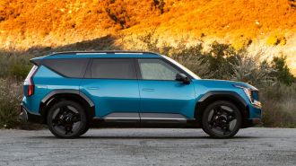 2024 Kia EV9 in blue at sunset.