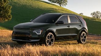 2024 Kia Niro in a grassy area.