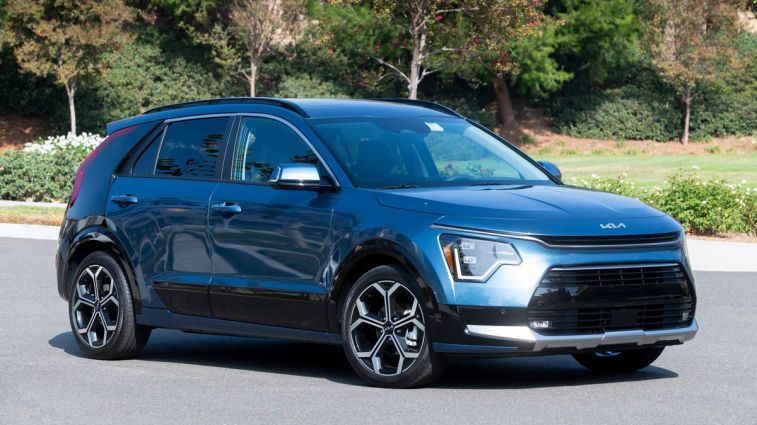 2024 Kia Niro PHEV with trees in the background.